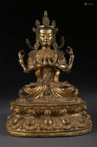 A Gilt Copper Four-Arm Avalokitesvara Statue.