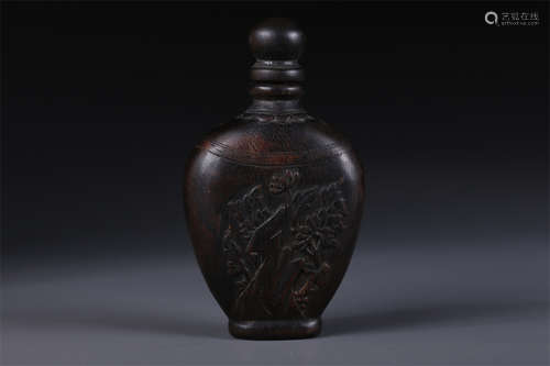 An Agarwood Snuff Bottle with Flower Design.