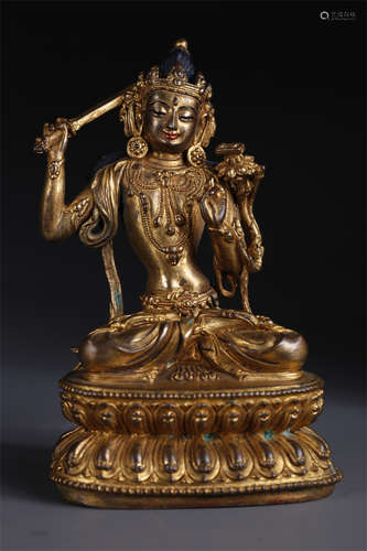 A Gilt Copper Manjusri Bodhisattva Statue.