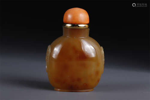 An Agate Snuff Bottle with Beast Face Design.