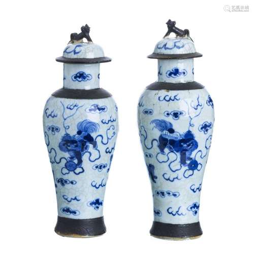 Pair of Chinese porcelain foo dog lidded pots