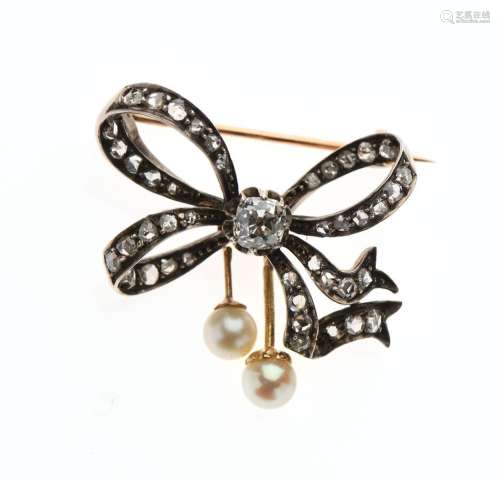 Petite BROCHE "Noeud" en or 750/°° et argent 800/°...