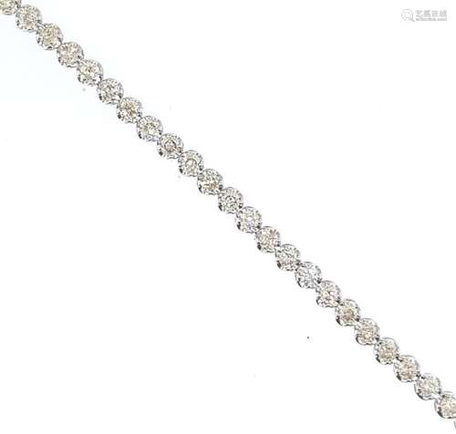 BRACELET ligne "rivière de diamants" en or gris 75...