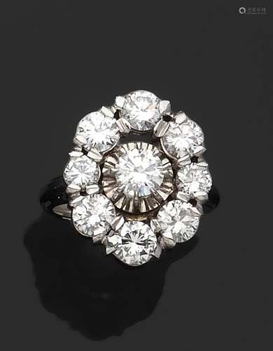 BAGUE "Marguerite" en platine 850/°° et or 750/°° ...