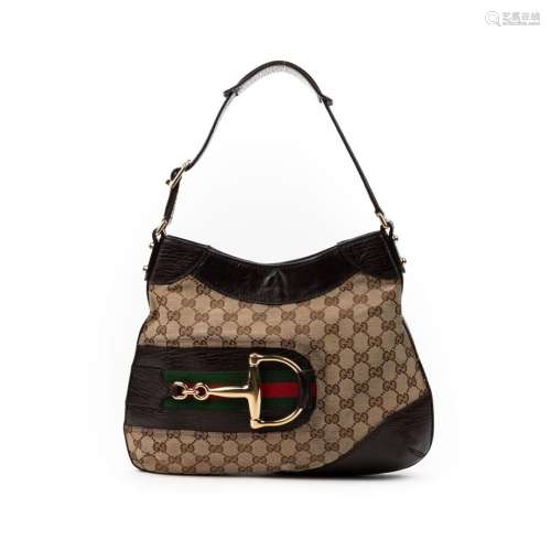 GUCCI- SAC modèle " Hobo" en cuir et toile matelas...