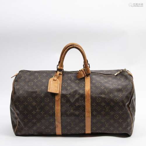 LOUIS VUITTON - SAC modèle "Keepall" 55 cm en toil...