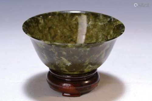 Small Jadeite bowl, China, 20th c., dark green, thin