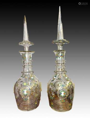 A PAIR OF CLEAR BOHEMIAN DECANTERS GILDING & ENAMEL WORK...