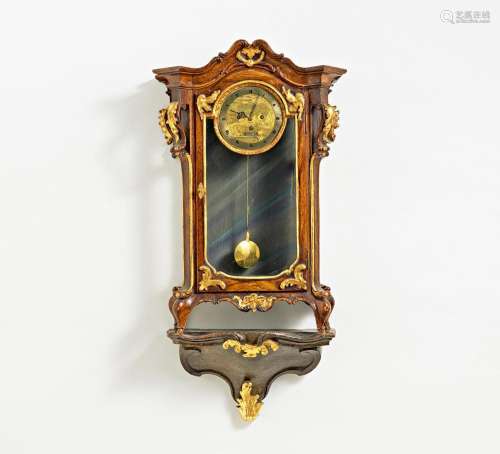 Wooden rococo clock on console