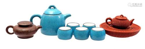 YIXING TEAPOT ON A WARMING DISH AND BLUE AND WHITE GLAZED YI...