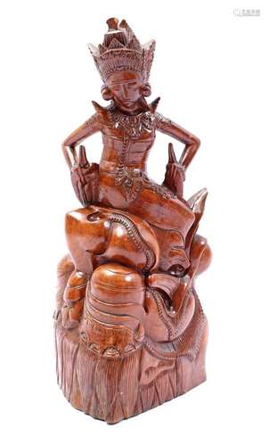 CARVED WOODEN STATUE OF A BALINESE DANCER