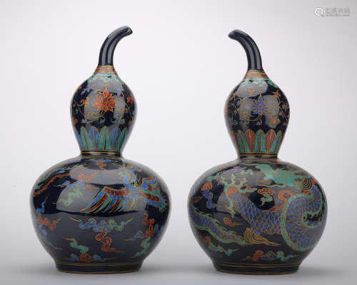 A pair of blue glazed 'dragon and phoenix' gourd-shaped vase