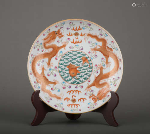 A allite red glazed 'dragon' dish painting in gold