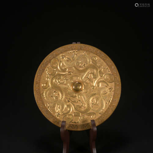 A gilt-bronze 'dragon'  mirror