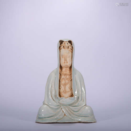 A celadon-glazed statue of Guanyin