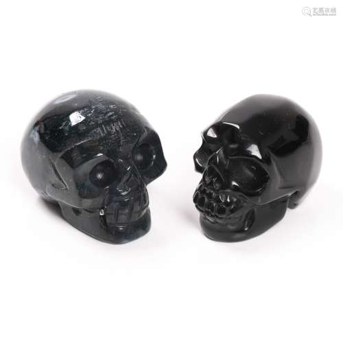 PAIR OF CARVED OBSIDIAN SKULLS