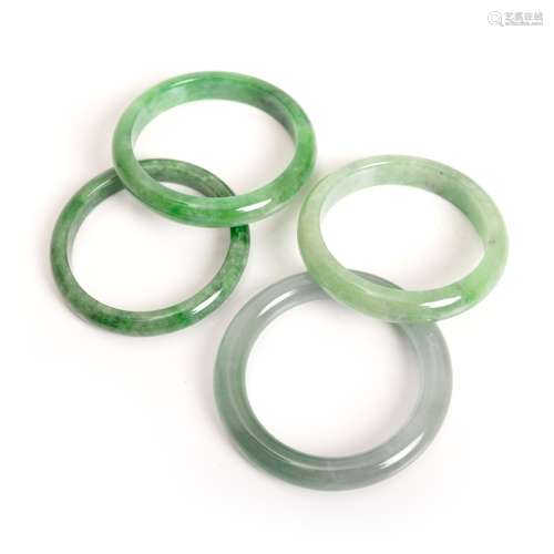 GROUP OF FOUR JADE BANGLES