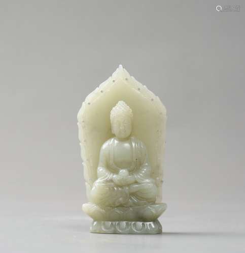 A Carved White Jade Buddha