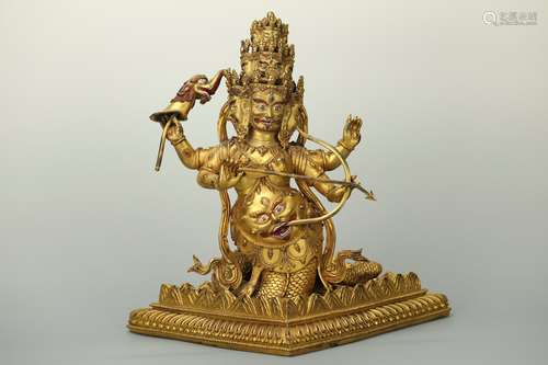 A Bronze-gilt Multi-hand Protector