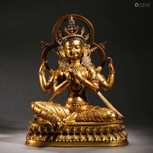 Qing Dynasty gilt bronze four-arm Guanyin Buddha