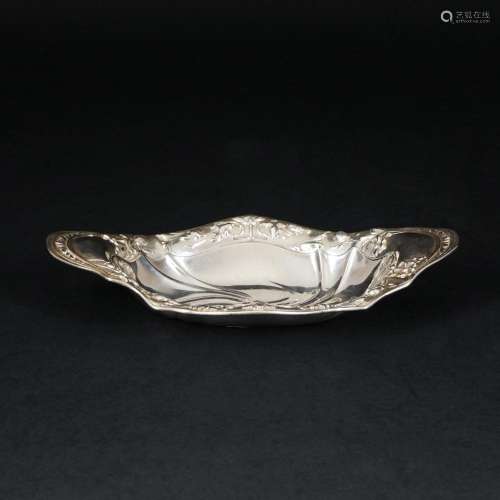 An oval silver bowl
