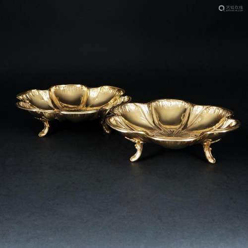 A pair of French silver gilt stands, 19th century