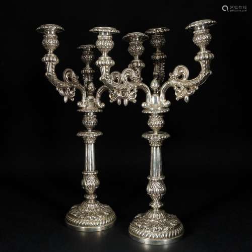 A pair of French double use silver three-light candelabra, 1...