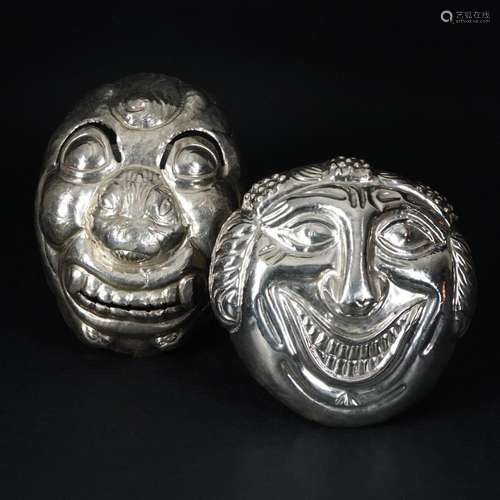 2 Oriental silver masks