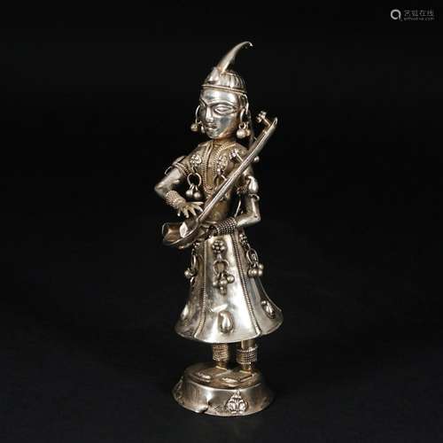 A Tibetan silver figure of a player, 19th century