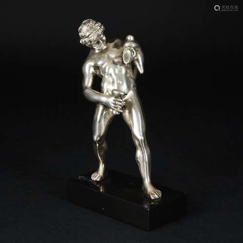 A silver figure of a young drinker, after the antique