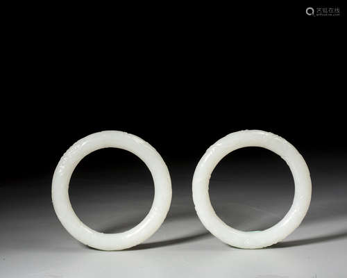 A PAIR OF CHINESE WHITE JADE BANGLES