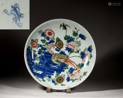 A CHINESE BLUE AND WHITE WUCAI 'FLORA AND BIRD' DISH,KANGXI ...