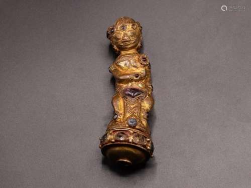 AN IMPORTANT GEM-SET GOLD GILT TIBETAN THRONE HANDLE, 18TH C...