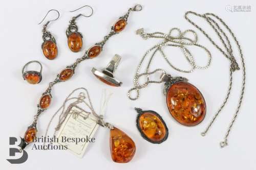 Three Silver and Amber Pendants