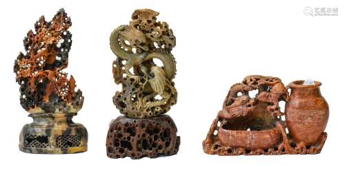 Three modern Chinese soapstone carvings, two depicting drago...