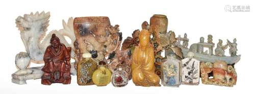 A collection of 20th century Oriental soapstone carvings dec...