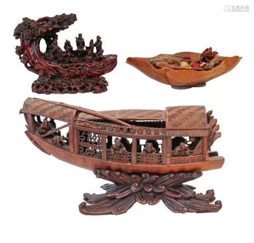 A Chinese carved wooden model of a boat, 34cm, a carved resi...