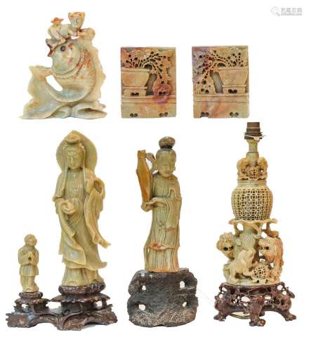 A group of Oriental soapstone carvings, including: a figure ...