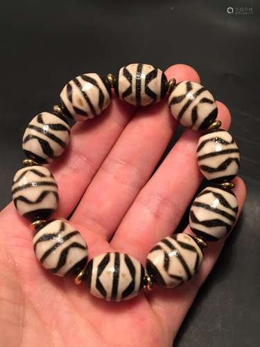 Canine teeth dallow day bead braceletExorcism beads, canine ...