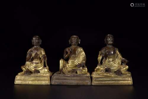 In the  : copper and gold guru's statue three pieces of ...