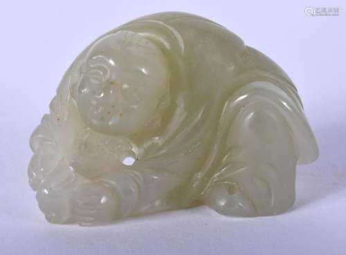 AN EARLY 20TH CENTURY CHINESE CARVED JADE FIGURE OF A BOY La...