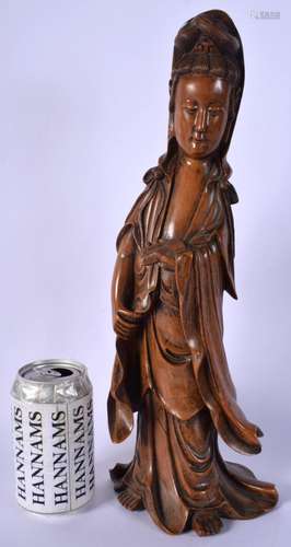 AN 18TH/19TH CENTURY CHINESE CARVED HARDWOOD FIGURE OF AN IM...