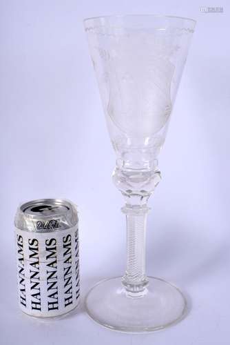 A LARGE EDWARDIAN CRYSTAL GLASS GOBLET engraved with an armo...