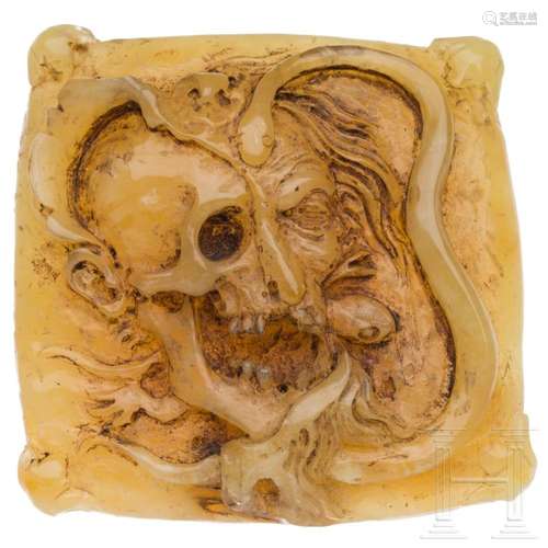 A German amber plaque with a memento mori in the style of th...