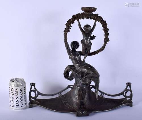 A LARGE ART NOUVEAU PEWTER FIGURAL LAMP modelled upon a spla...