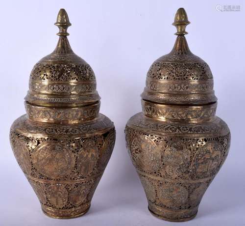 A PAIR OF 19TH CENTURY PERSIAN QAJAR BRASS VASES AND COVERS ...