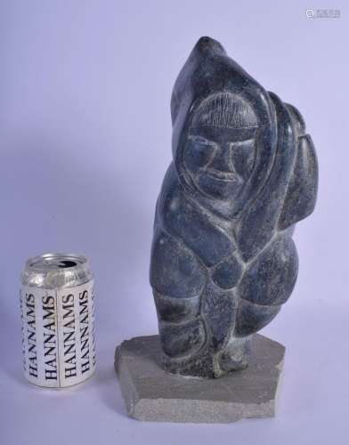 A LARGE NATIVE AMERICAN CANADIAN INUIT CARVED STONE FIGURE m...