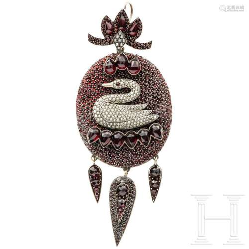 A double garnets and pearls medallion with swan