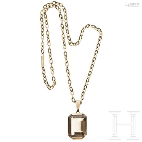 A gold chain with a smoky quartz pendant, circa 1950