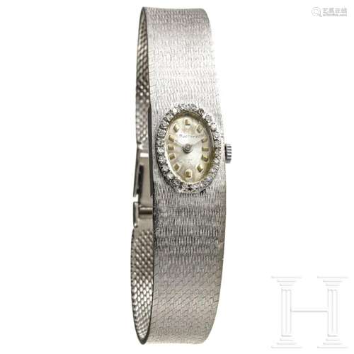 A white Swiss 14 carats lady's gold and diamond wrist wa...